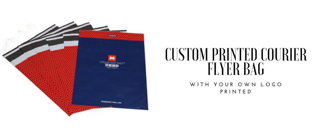 A stack of courier bags, some red with a black dot pattern and a black and white striped flap, and one dark blue bag with a red logo and text.