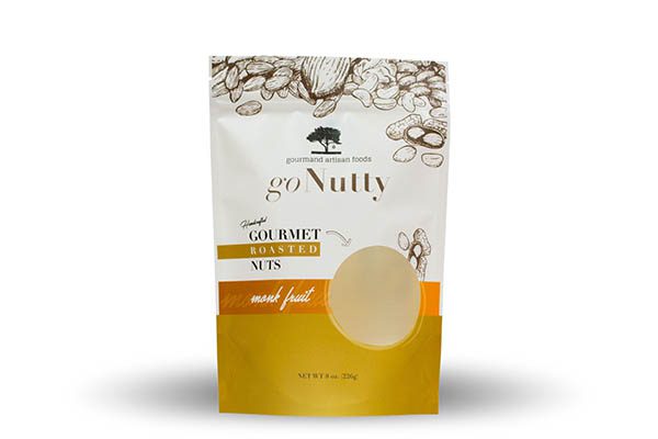 A white and gold stand-up pouch for gourmet roasted nuts, featuring line drawings of nuts at the top and a circular window showing the product.