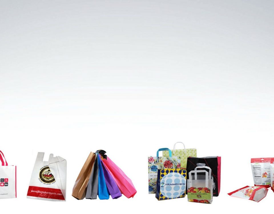 A collection of various retail bags and pouches displayed against a white background. Includes tote bags with handles, gusseted pouches with resealable closures, and flat bags with printed graphics.
