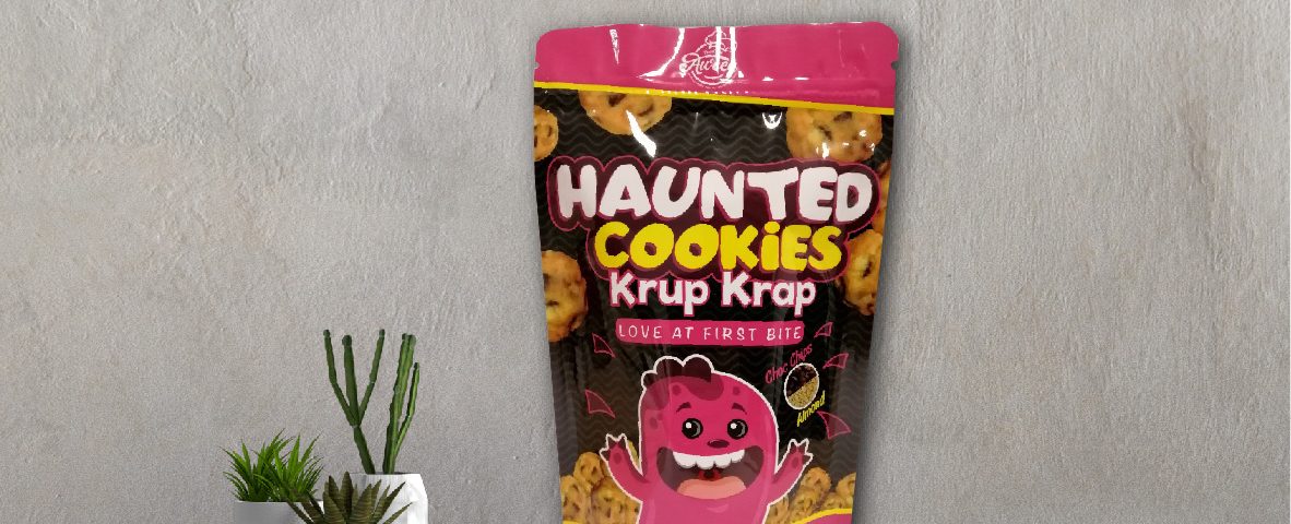 A product image with a pink and black package of Haunted Cookies (Krap-krau ; ; ; ; ;