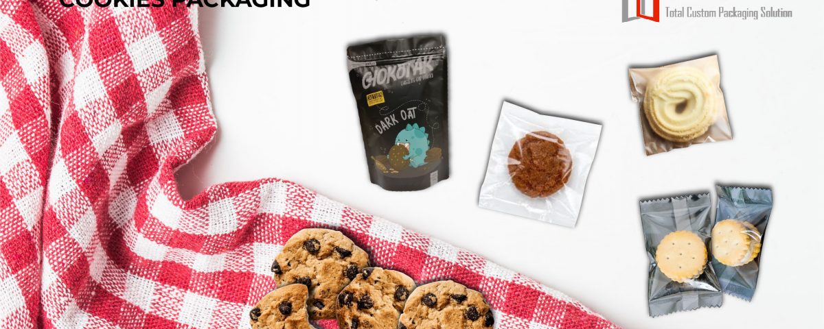 A collection of various cookie packages and loose cookies arranged on a white surface with a red and white checkered cloth.
