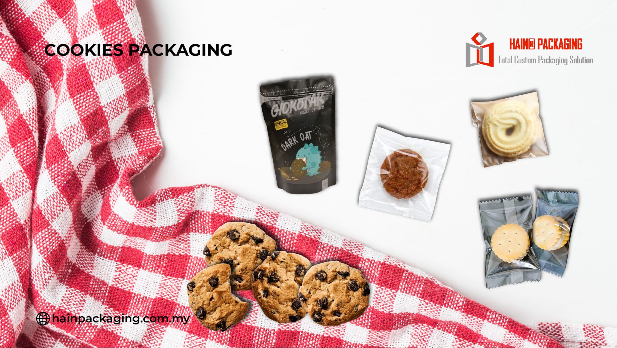 A collection of various cookie packages and loose cookies arranged on a white surface with a red and white checkered cloth.