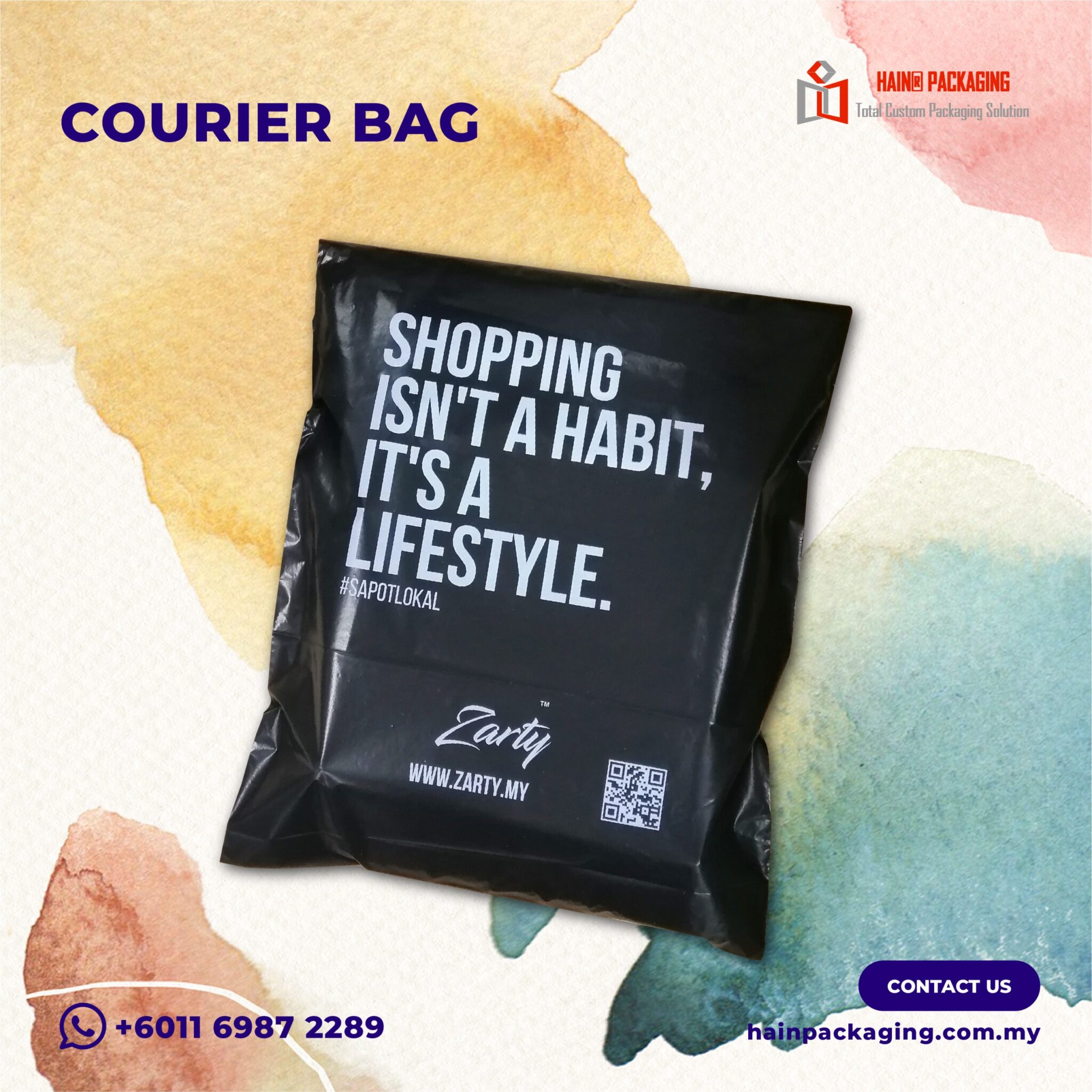 Black branded shipping packaging with white slogan text, a brand name, a website and a QR code printed on the front panel