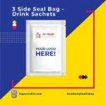 A white, three-side seal sachet bag with "YOUR LOGO HERE!" printed in blue, and a smaller logo above. The sachet is presented on a vibrant blue and yellow background with graphic elements.