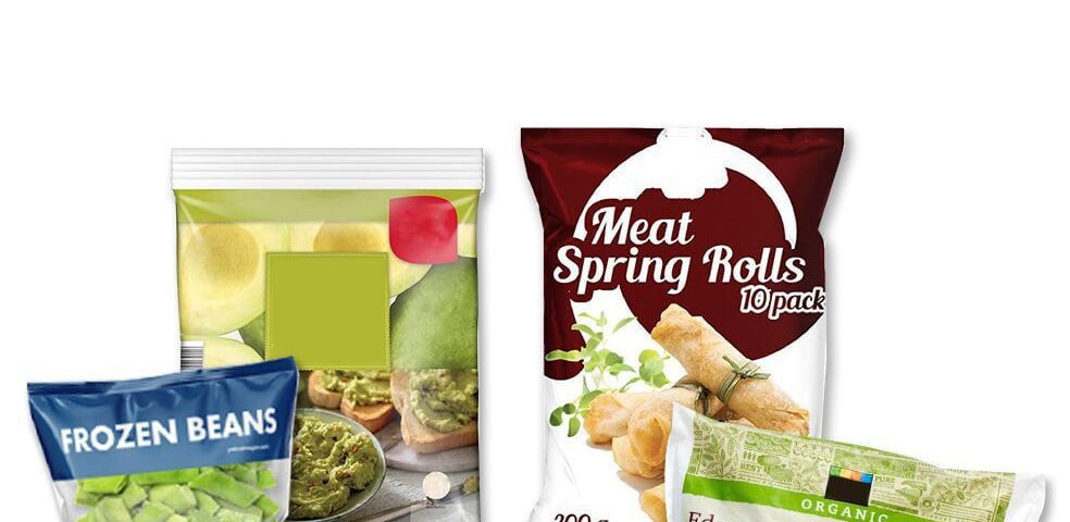 Four different food packages are displayed. One is a dark blue bag labeled 'FROZEN BEANS'. Next to it is a clear bag with a green and white design showing avocado and toast. A dark red bag is labeled 'Meat Spring Rolls 10 pack'. In front of that is a white bag with green accents labeled 'ORGANIC Edamame'.
