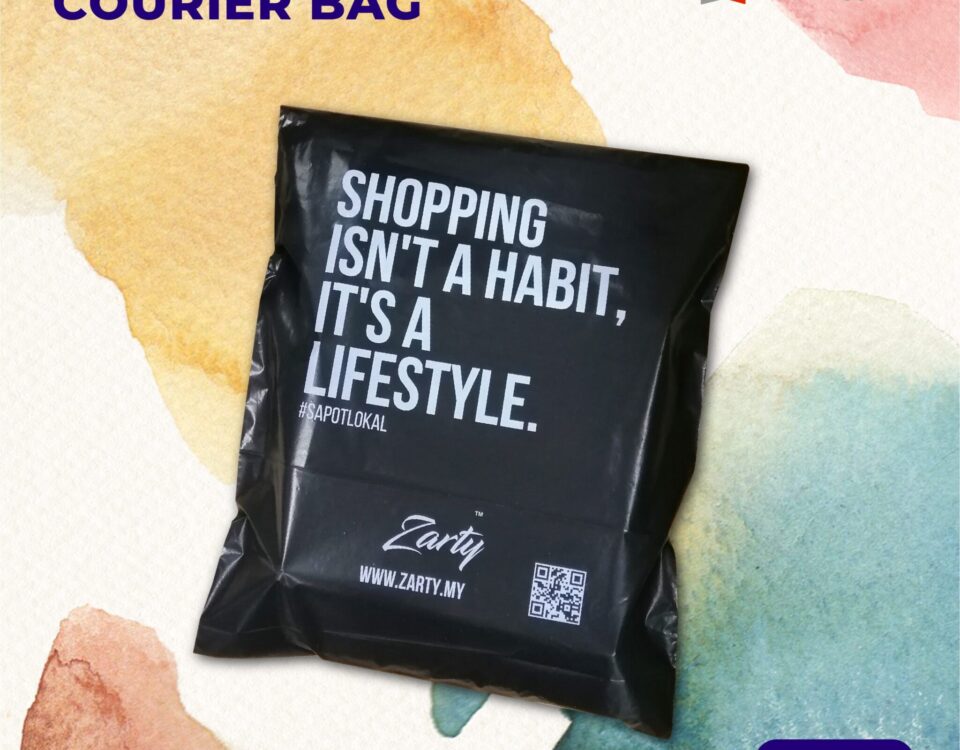 A black courier bag with white text printed on it, placed on a background with watercolor splashes.