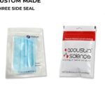 Two sealed pouches are displayed. The left pouch is transparent and contains blue face masks. The right pouch is white with red and black printing, advertising guitar strings.
