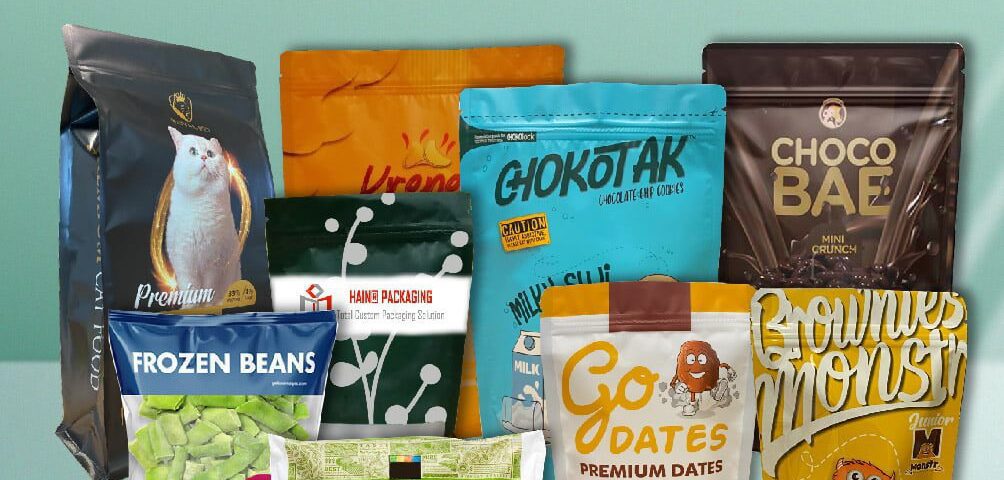 A collection of various stand-up pouches and bags for food products, including cat food, frozen beans, edamame, cookies, dates, and brownies, displayed against a light blue background.