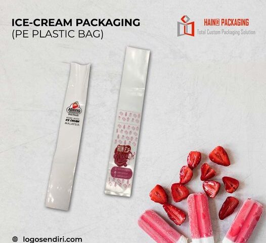 Two clear plastic bags designed for ice cream packaging are displayed. One bag has a label with a strawberry logo and text, while the other features a repeating pattern and a circular label with text and graphics. Sliced strawberries and ice cream bars are arranged nearby.
